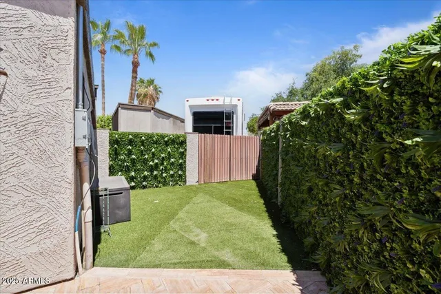 a view of a livingroom with wooden floor and windows