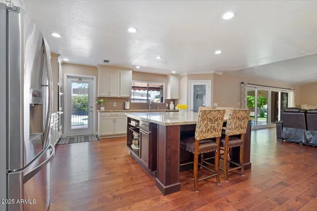 a living room with a bed furniture and a window
