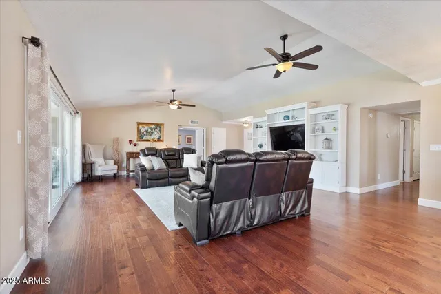 a view of a house with swimming pool and sitting area