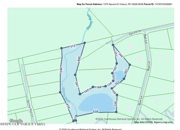 a view of a building with a street sign and a pathway