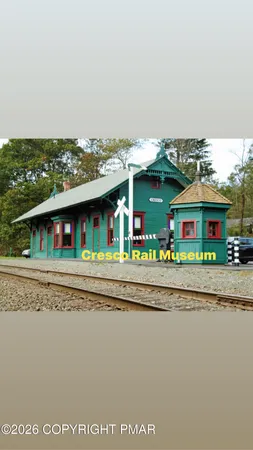 a view of an chairs and table in a yard