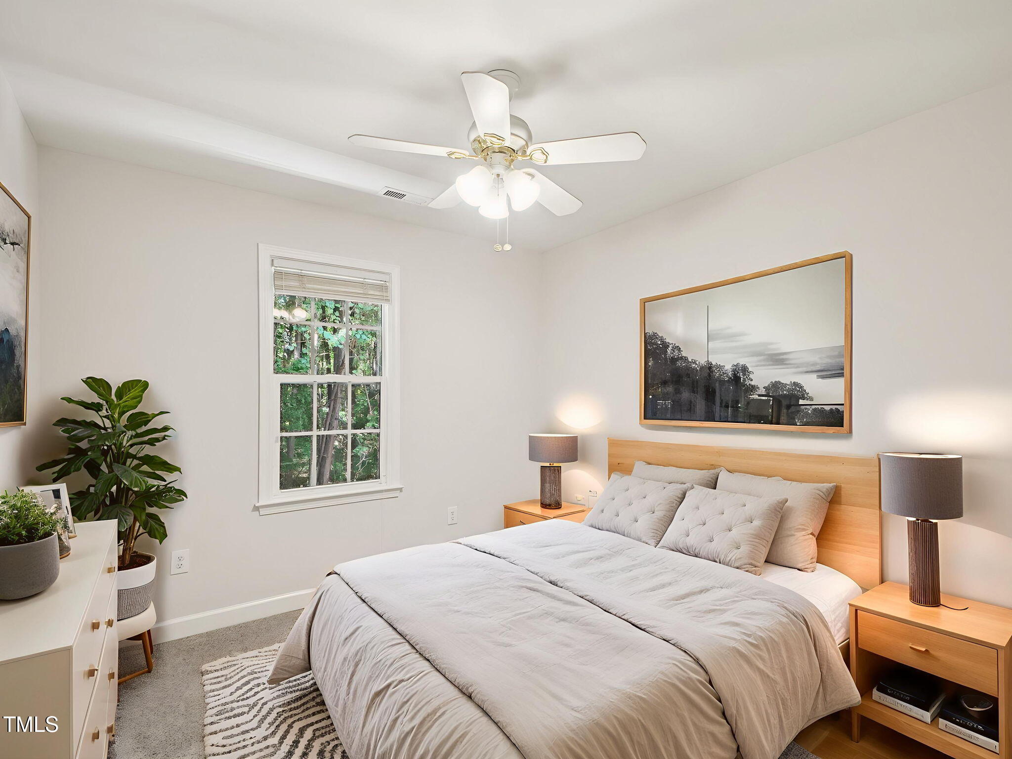 2228 Trailwood Valley Circle Raleigh, NC 27603 - Photo 16 of 19 a bedroom with a large bed and a window