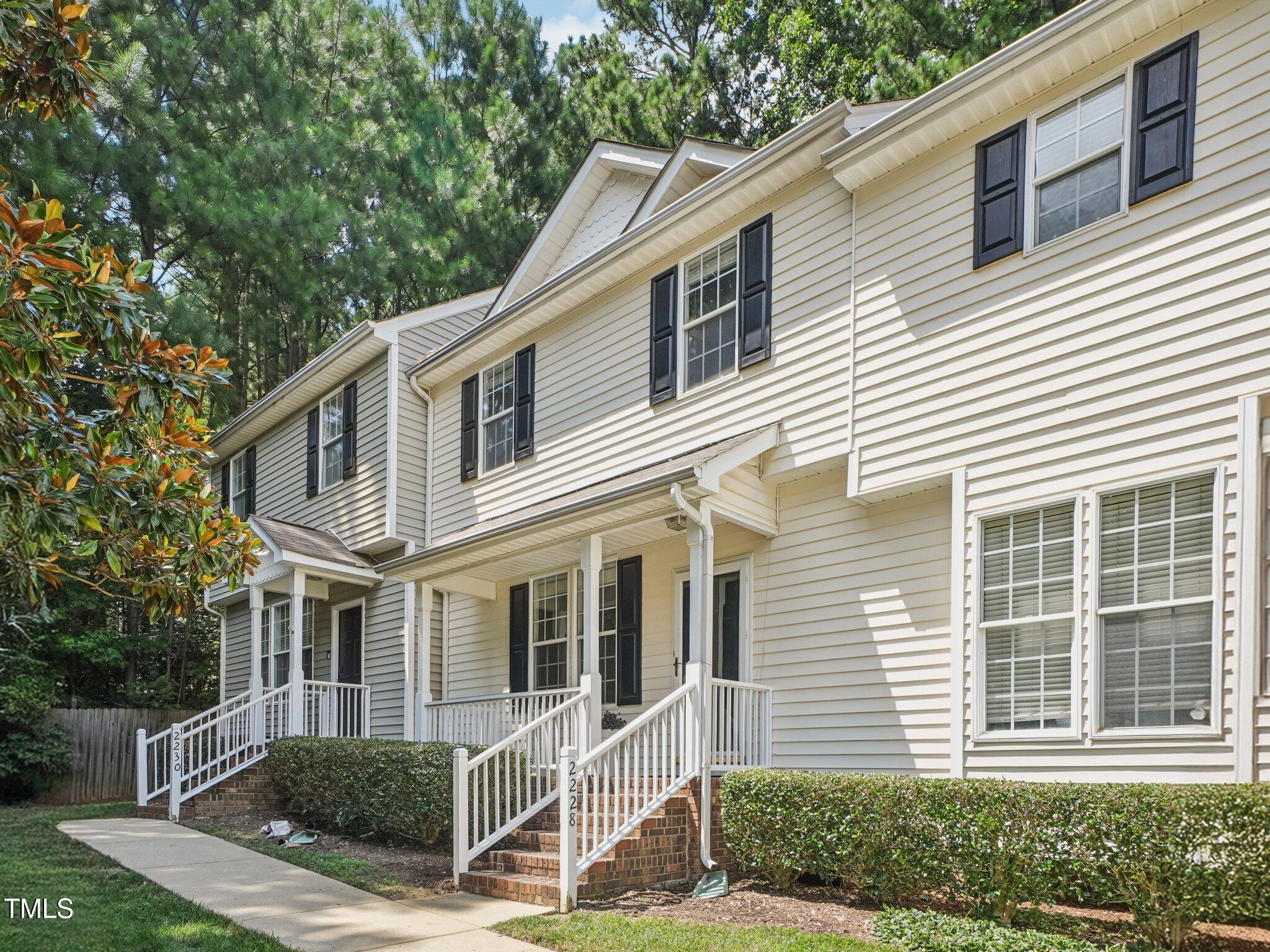 2228 Trailwood Valley Circle Raleigh, NC 27603 - Photo 2 of 19 a front view of a house with a yard
