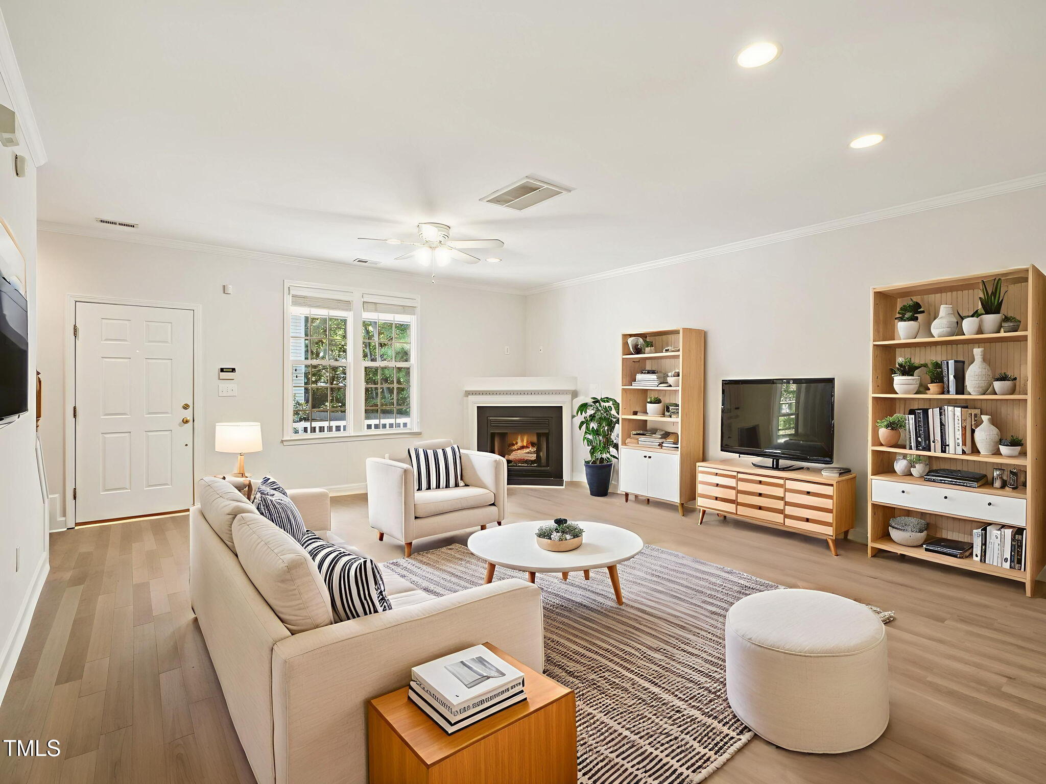 2228 Trailwood Valley Circle Raleigh, NC 27603 - Photo 5 of 19 a living room with furniture and a flat screen tv