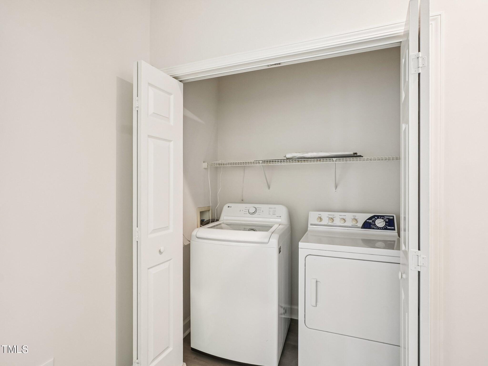 2228 Trailwood Valley Circle Raleigh, NC 27603 - Photo 9 of 19 a utility room with dryer and washer