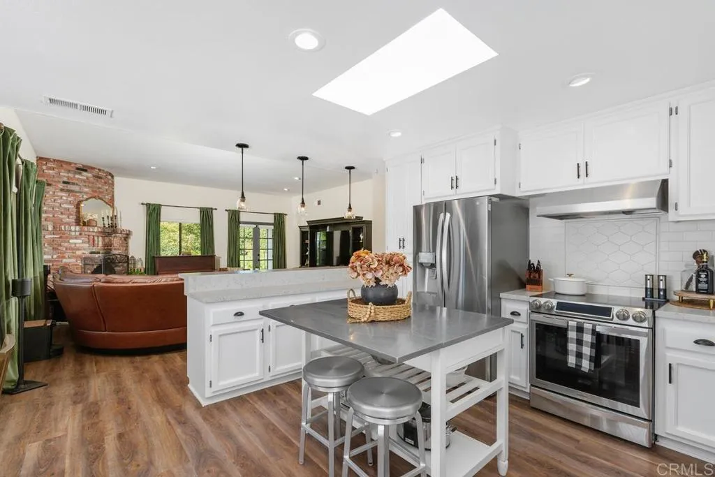 2625 Havencrest Drive Fallbrook, CA 92028 - Photo 1 of 35 a kitchen with stainless steel appliances a stove a sink a refrigerator and cabinets