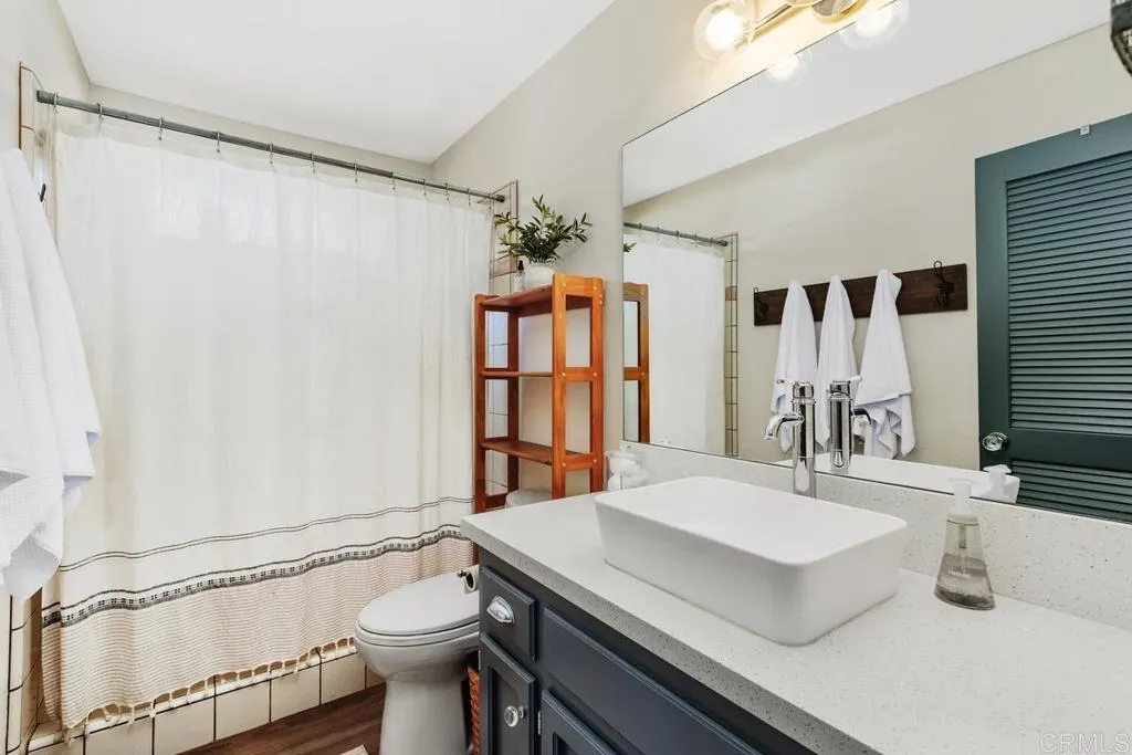 2625 Havencrest Drive Fallbrook, CA 92028 - Photo 16 of 35 a bathroom with a sink a toilet and shower