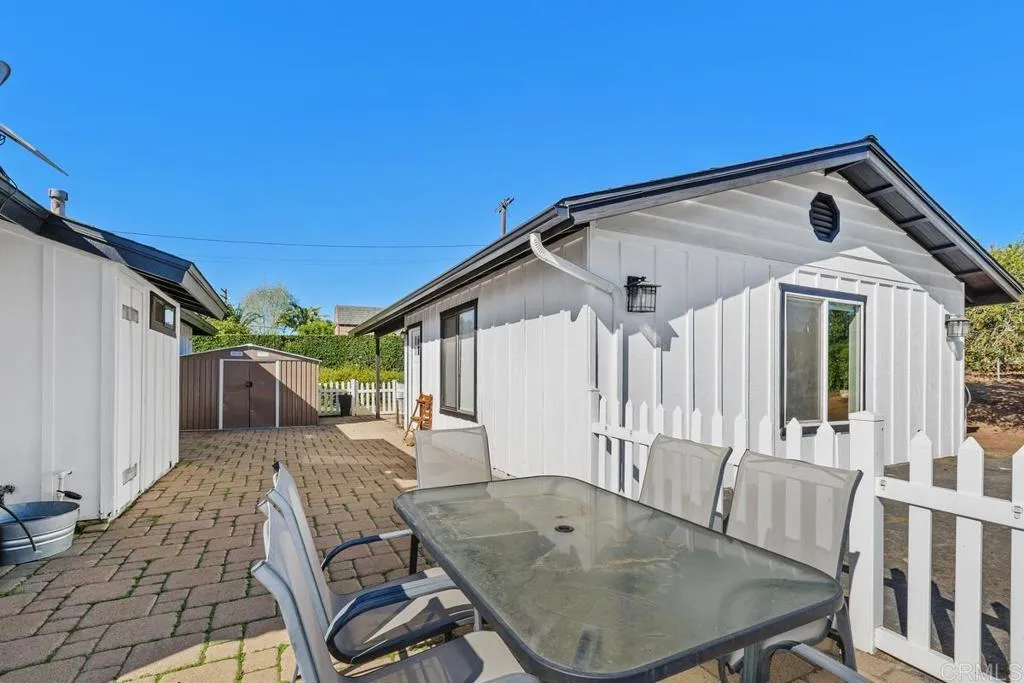 2625 Havencrest Drive Fallbrook, CA 92028 - Photo 24 of 35 a view of a patio with table and chairs with wooden floor and fence