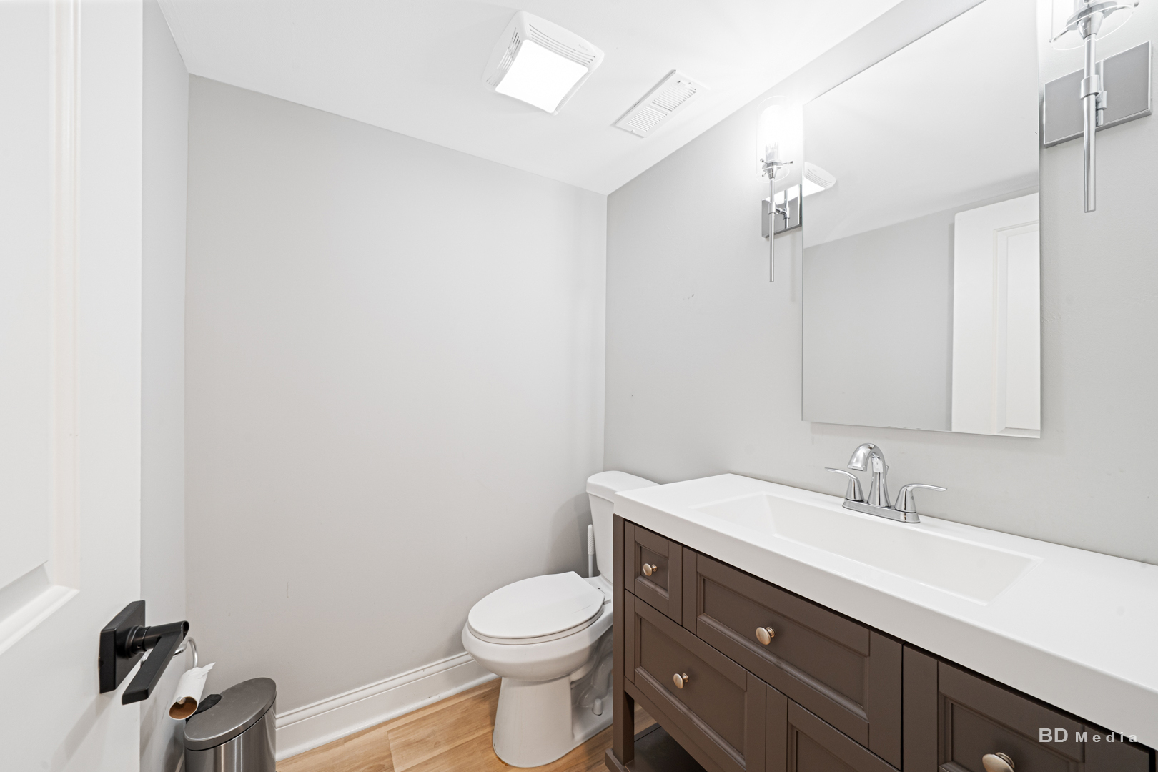 15717 Orlan Brook Drive, Unit G83 Orland Park, IL 60462 - Photo 11 of 21 a bathroom with a sink a toilet and mirror