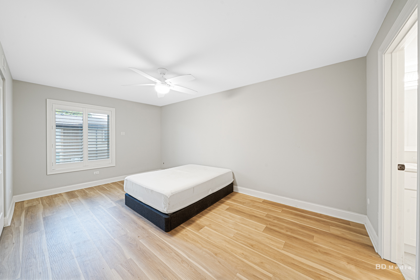 15717 Orlan Brook Drive, Unit G83 Orland Park, IL 60462 - Photo 12 of 21 a spacious bedroom with a bed and a window