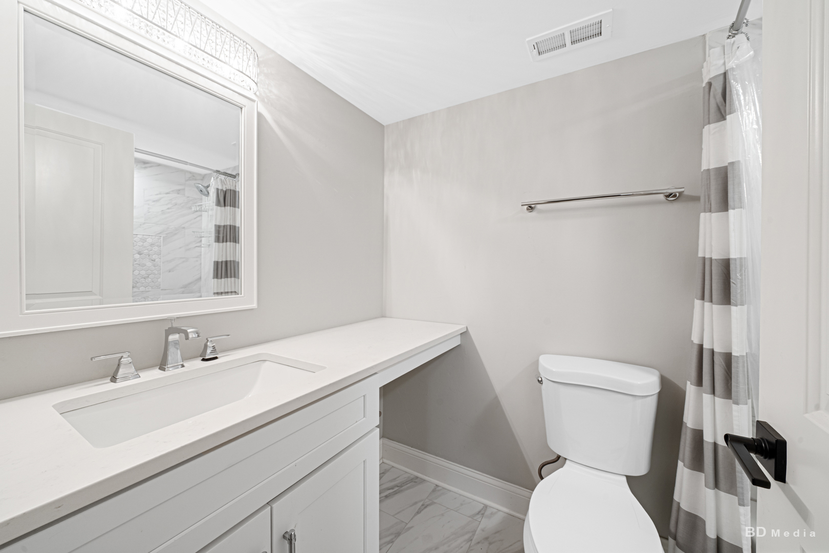 15717 Orlan Brook Drive, Unit G83 Orland Park, IL 60462 - Photo 14 of 21 a bathroom with a sink a toilet a mirror and shower