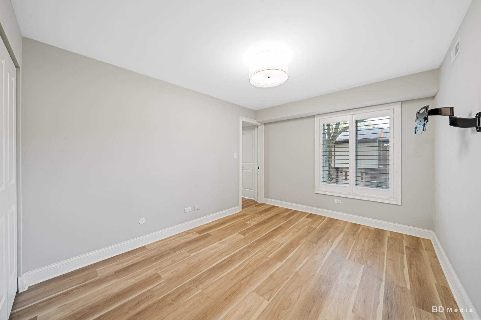 15717 Orlan Brook Drive, Unit G83 Orland Park, IL 60462 - Photo 15 of 21 a view of an empty room with wooden floor and a window