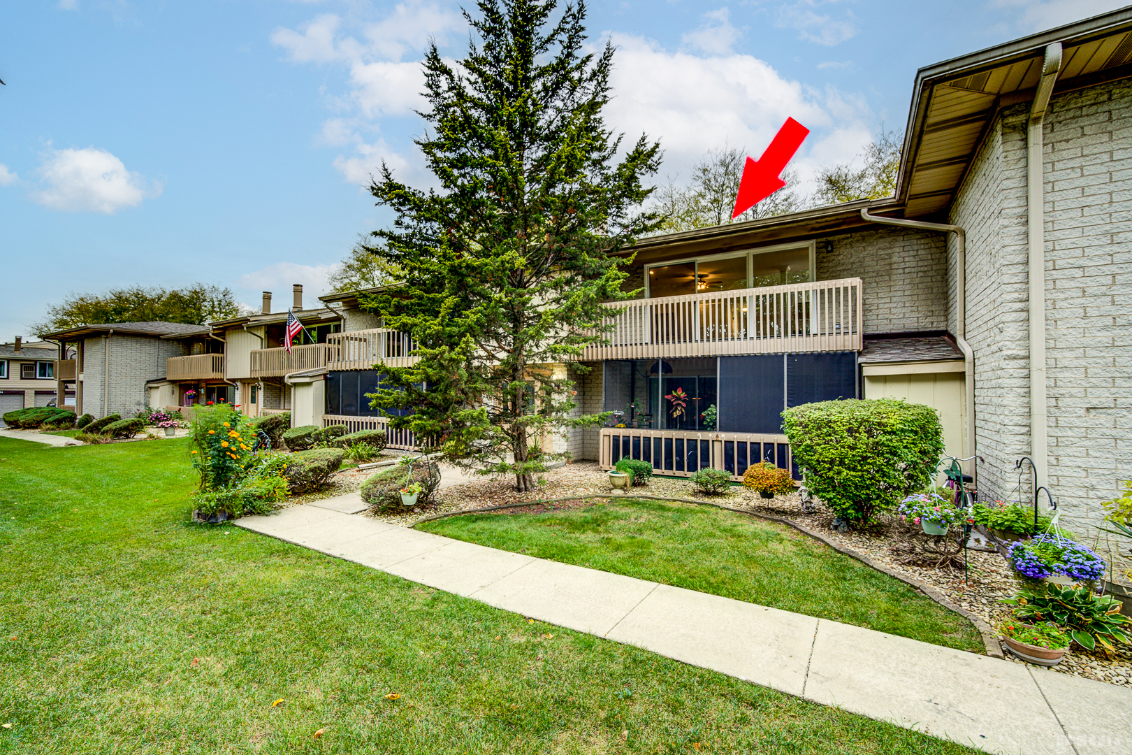15717 Orlan Brook Drive, Unit G83 Orland Park, IL 60462 - Photo 2 of 21 a front view of a house with a yard