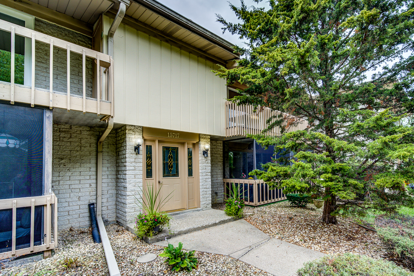 15717 Orlan Brook Drive, Unit G83 Orland Park, IL 60462 - Photo 3 of 21 a view of a house with potted plants and a tree