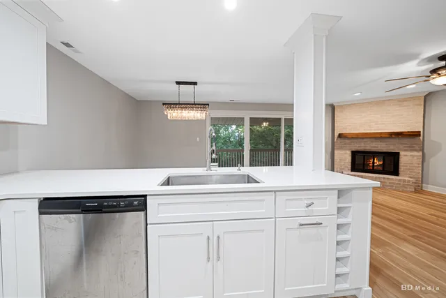 a kitchen with cabinets and window