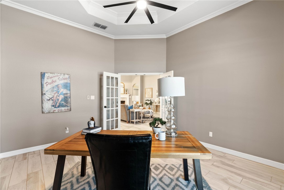 401 Big Shell Court Corpus Christi, TX 78418 - Photo 11 of 26 a view of a dining room with furniture and wooden floor