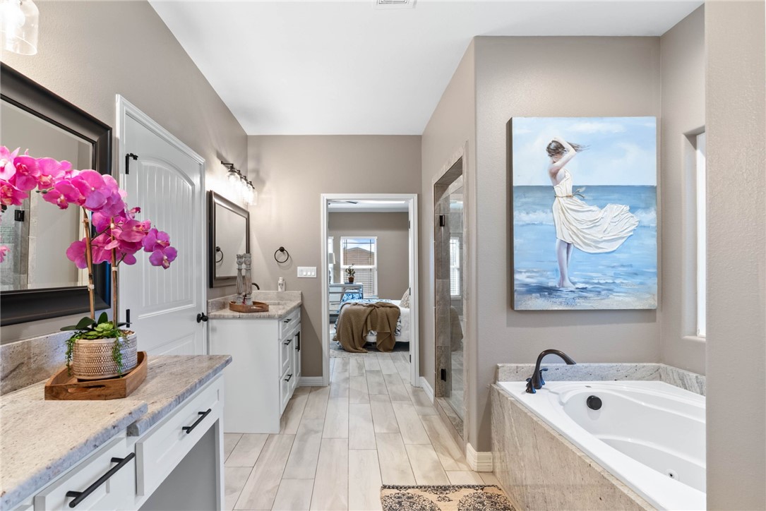 401 Big Shell Court Corpus Christi, TX 78418 - Photo 16 of 26 a bath room with a sink tub and view kitchen