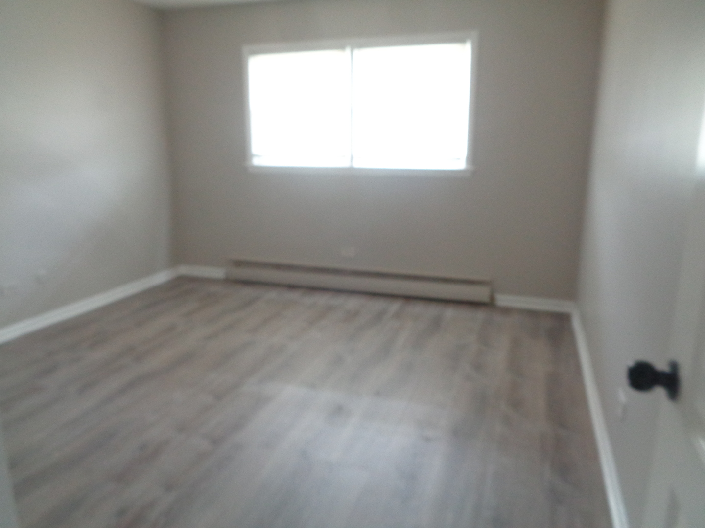 1340 North Main Street, Unit B11 Wheaton, IL 60187 - Photo 8 of 10 an empty room with a window