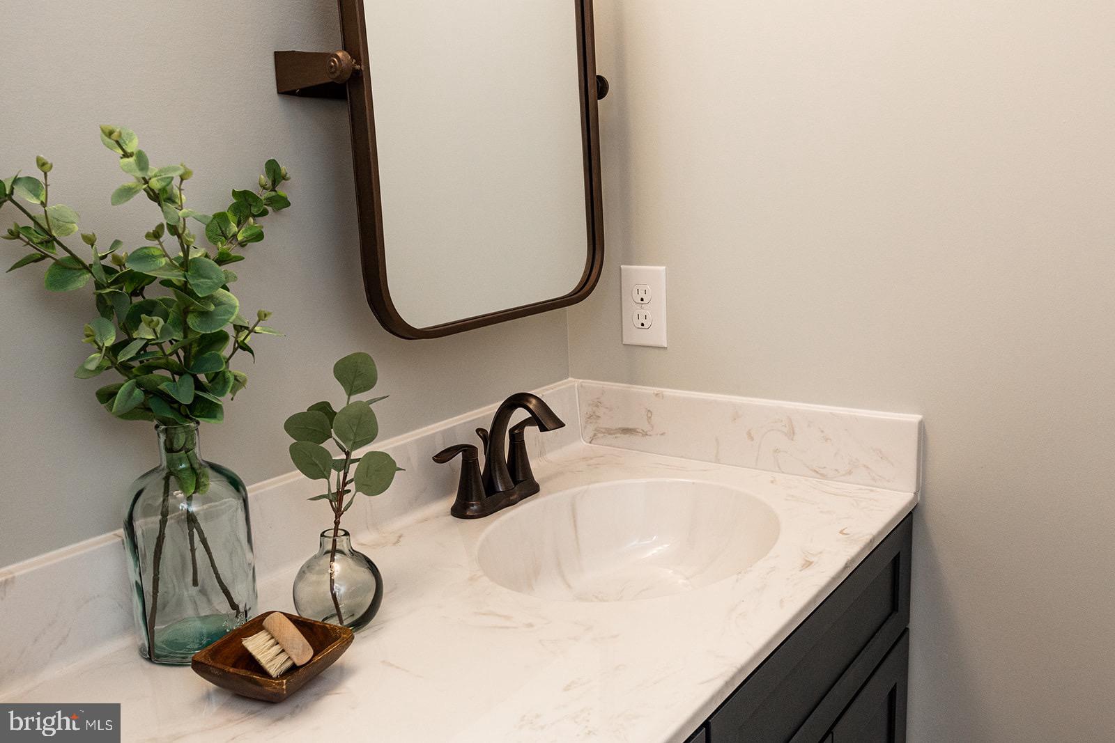 Greenwood Drive #f Greenwood Drive, Unit F Oxford, PA 19363 - Photo 70 of 110 a bathroom with a sink a mirror and a potted plant