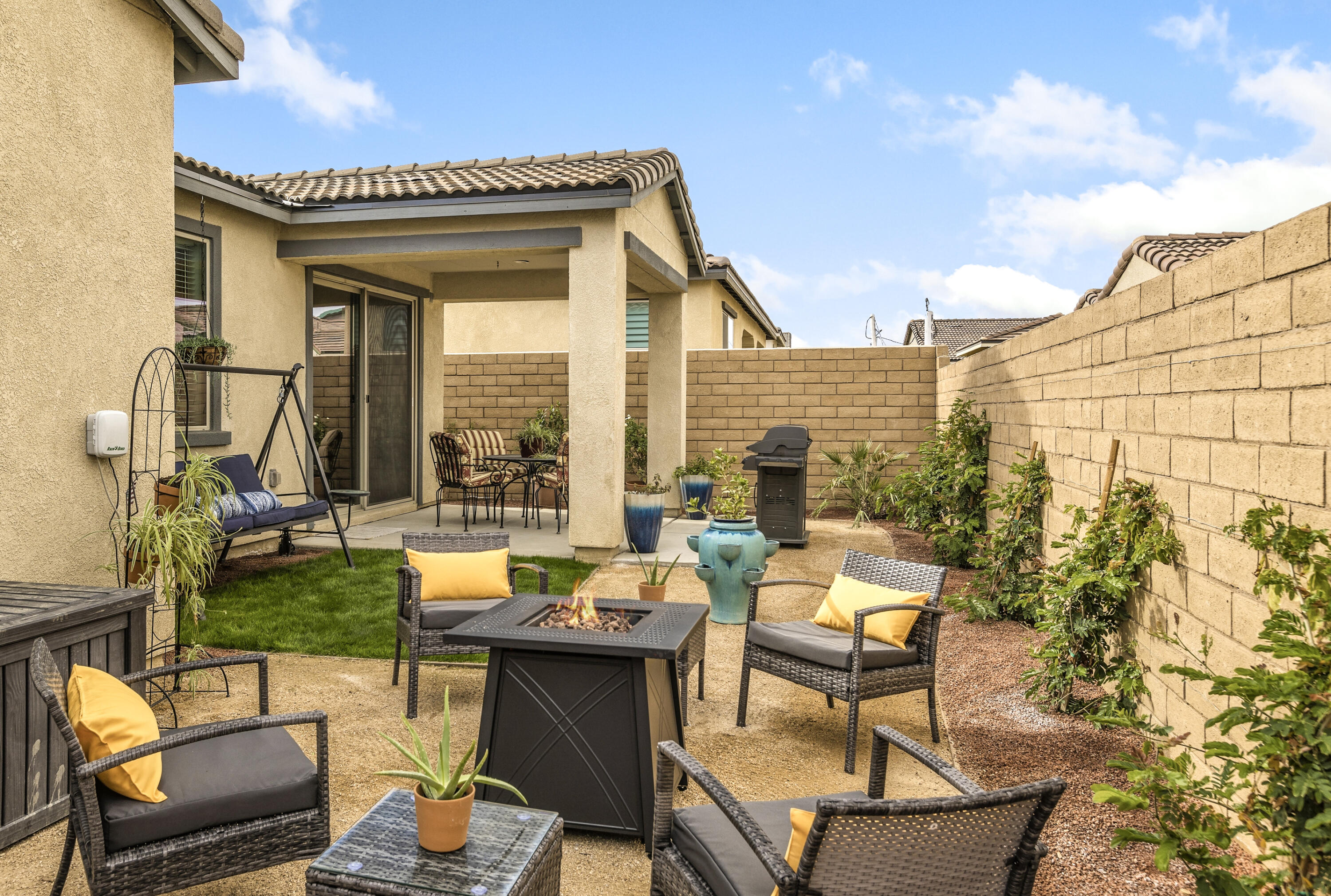 78804 Santa Rosa Way Palm Desert, CA 92211 - Photo 1 of 40 a view of a patio with table and chairs and potted plants