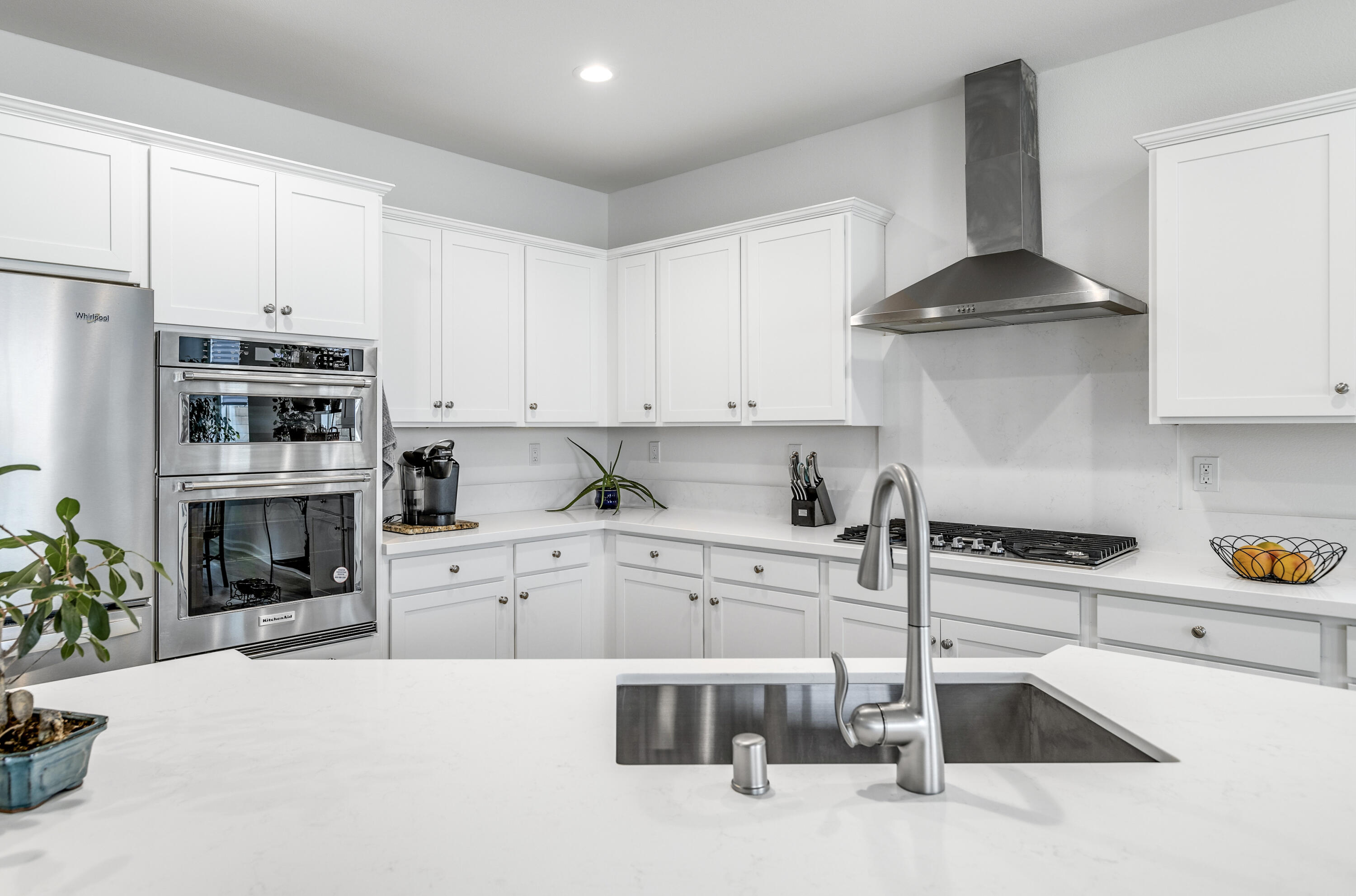 78804 Santa Rosa Way Palm Desert, CA 92211 - Photo 13 of 40 a kitchen with granite countertop white cabinets and a stove