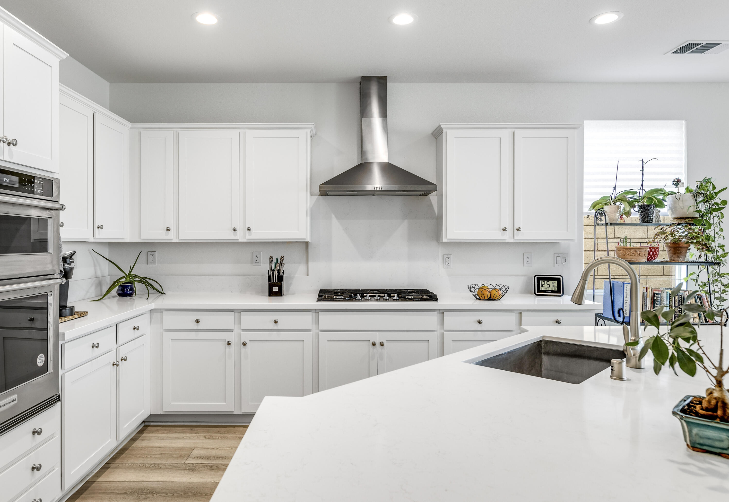 78804 Santa Rosa Way Palm Desert, CA 92211 - Photo 15 of 40 a kitchen with a white cabinets and white appliances