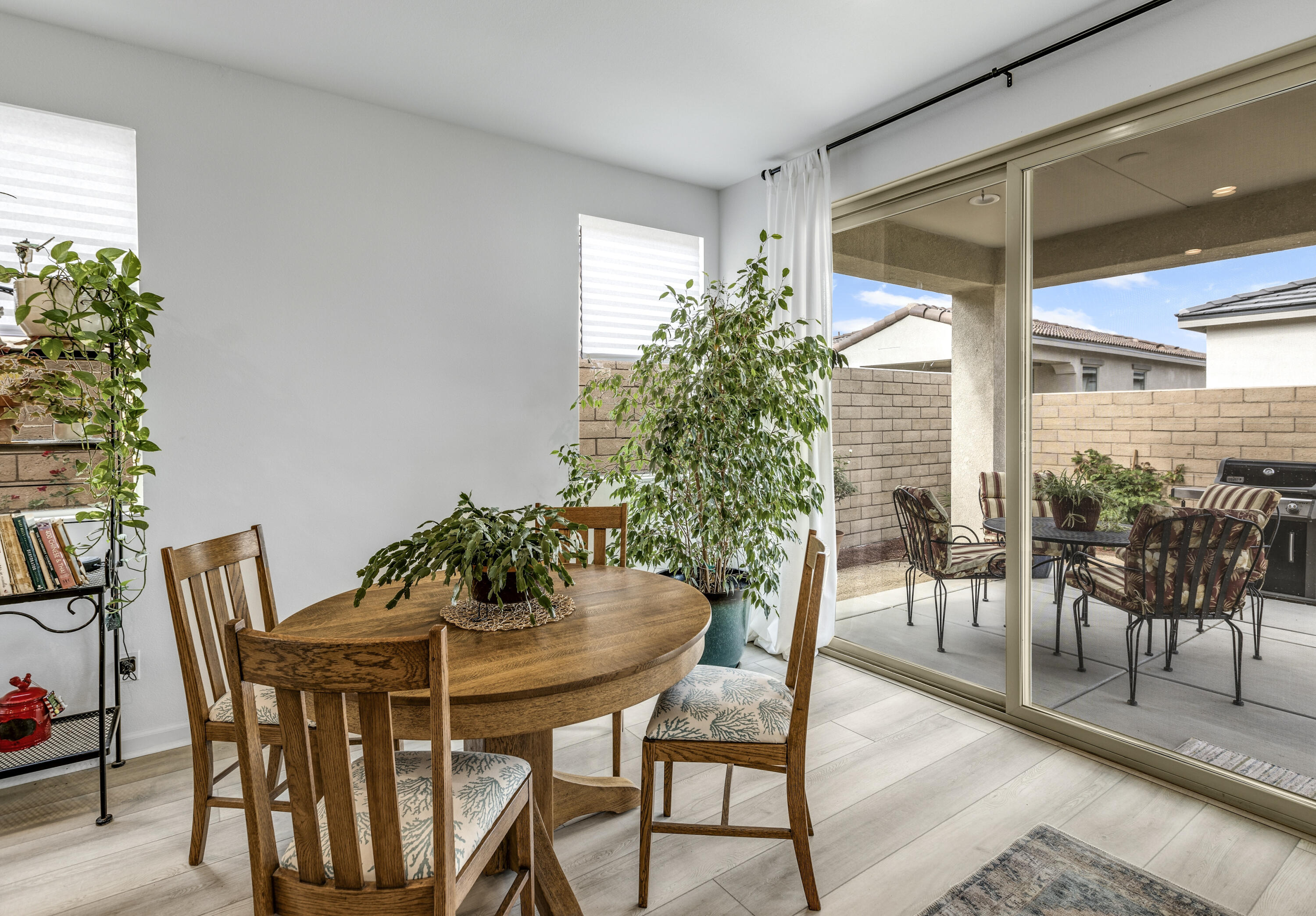 78804 Santa Rosa Way Palm Desert, CA 92211 - Photo 18 of 40 a dining room table with chairs and potted plants