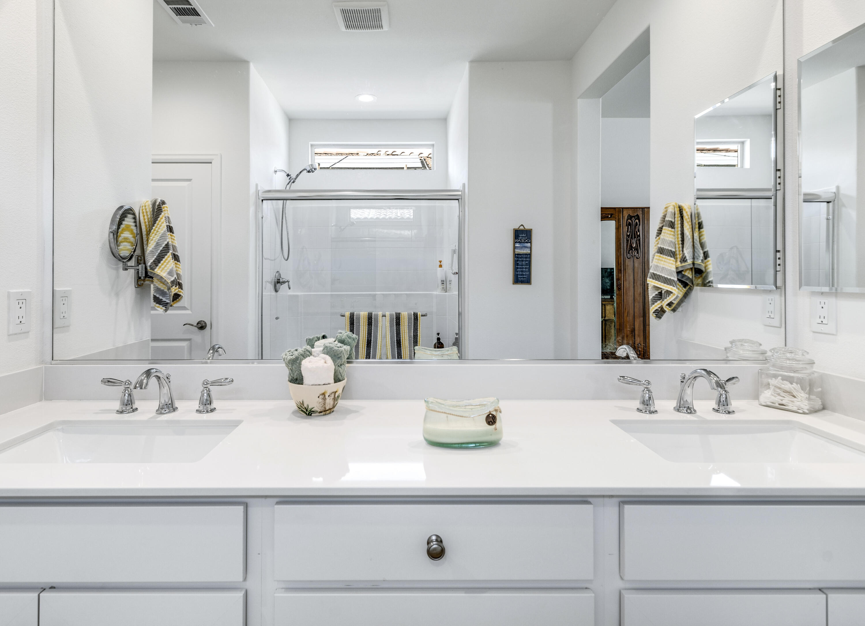 78804 Santa Rosa Way Palm Desert, CA 92211 - Photo 26 of 40 a bathroom with double vanity sinks a vanity and a mirror