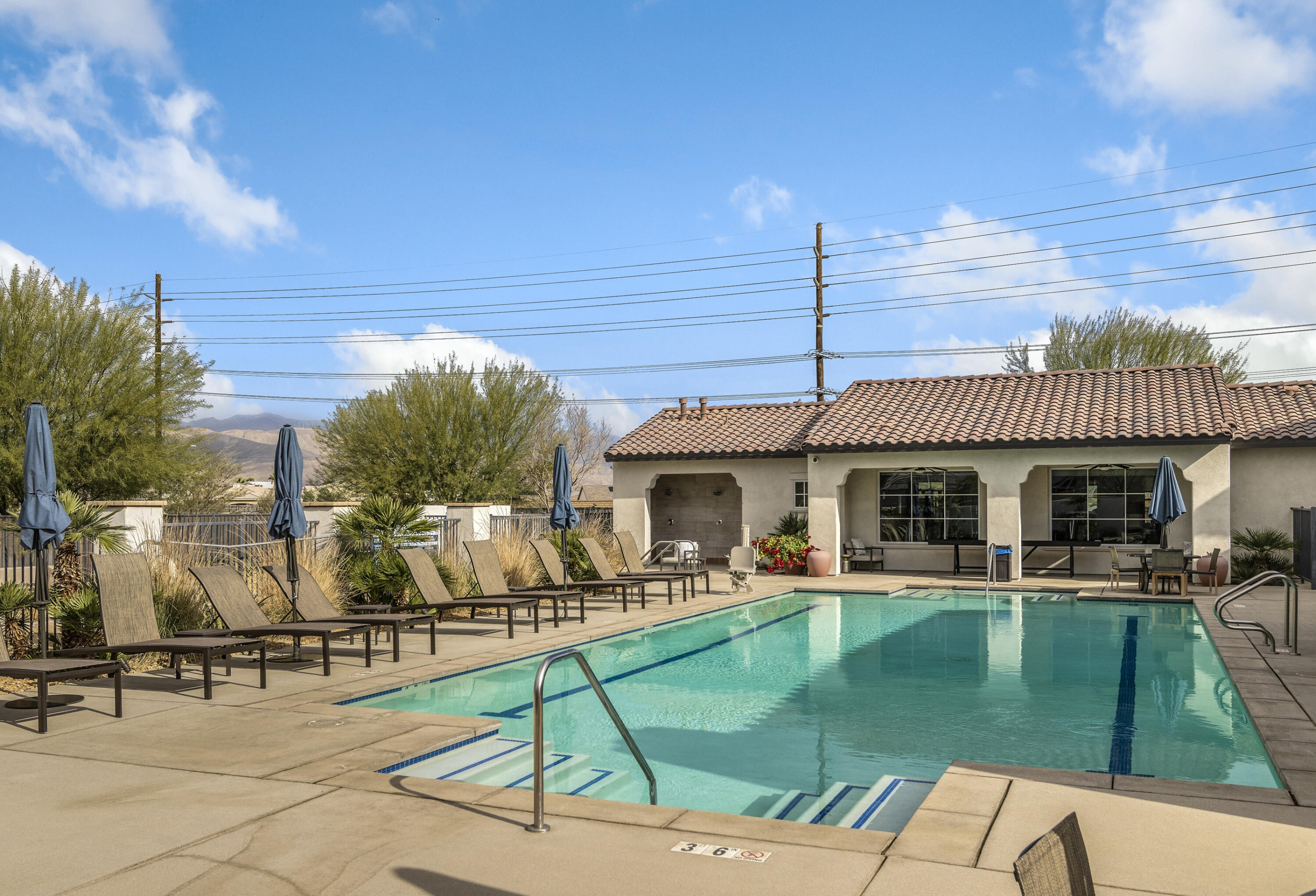 78804 Santa Rosa Way Palm Desert, CA 92211 - Photo 36 of 40 a view of a patio with swimming pool table and chairs