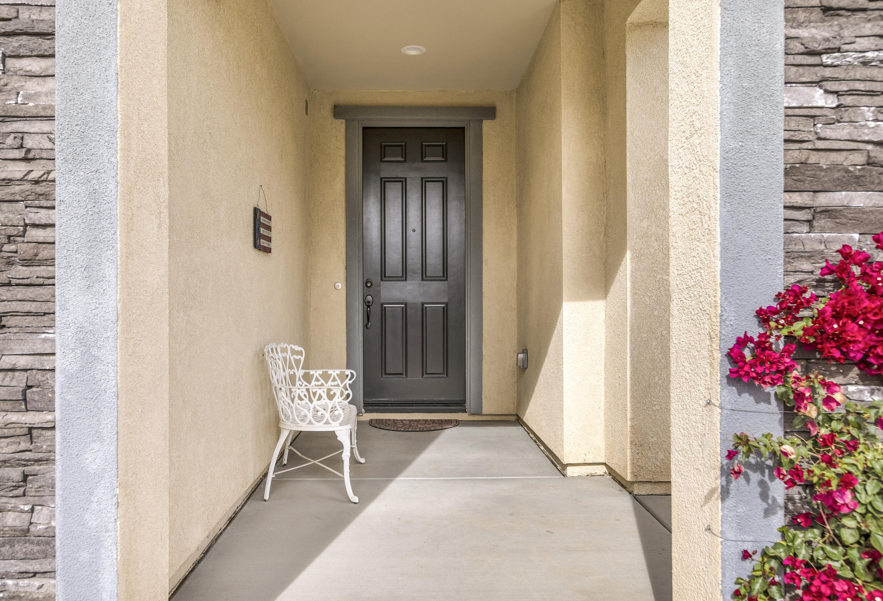 78804 Santa Rosa Way Palm Desert, CA 92211 - Photo 4 of 40 a view of a hallway with wooden floor and a dining room