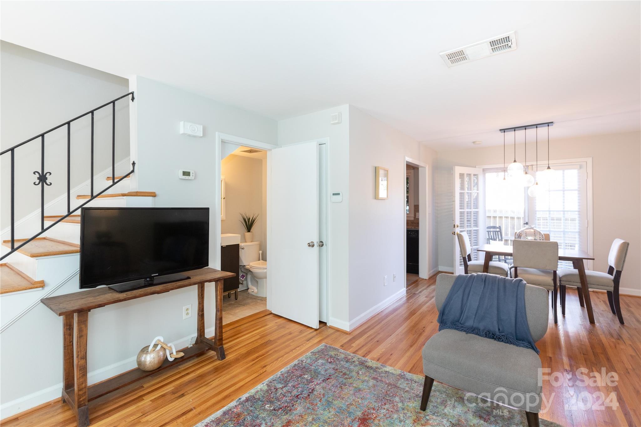 856 McAlway Road, Unit B Charlotte, NC 28211 - Photo 11 of 25 a living room with furniture and a flat screen tv