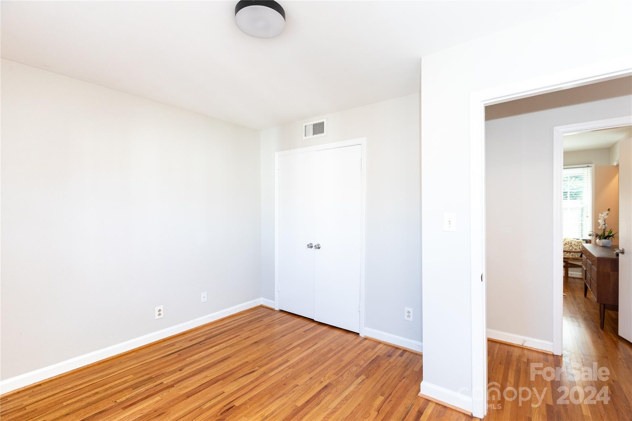 856 McAlway Road, Unit B Charlotte, NC 28211 - Photo 19 of 25 a view of a room with wooden floor