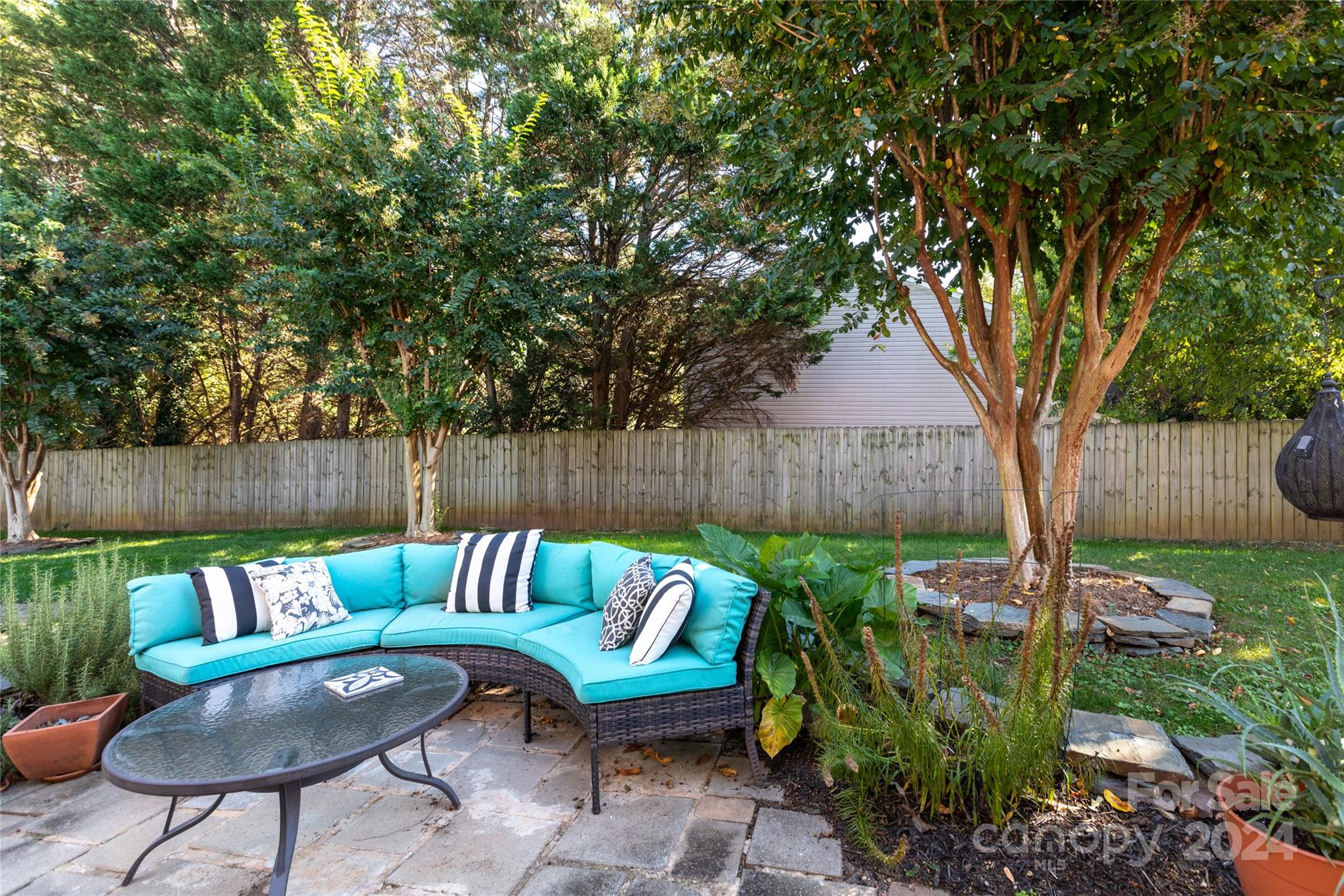 856 McAlway Road, Unit B Charlotte, NC 28211 - Photo 23 of 25 a backyard of a house with table and chairs