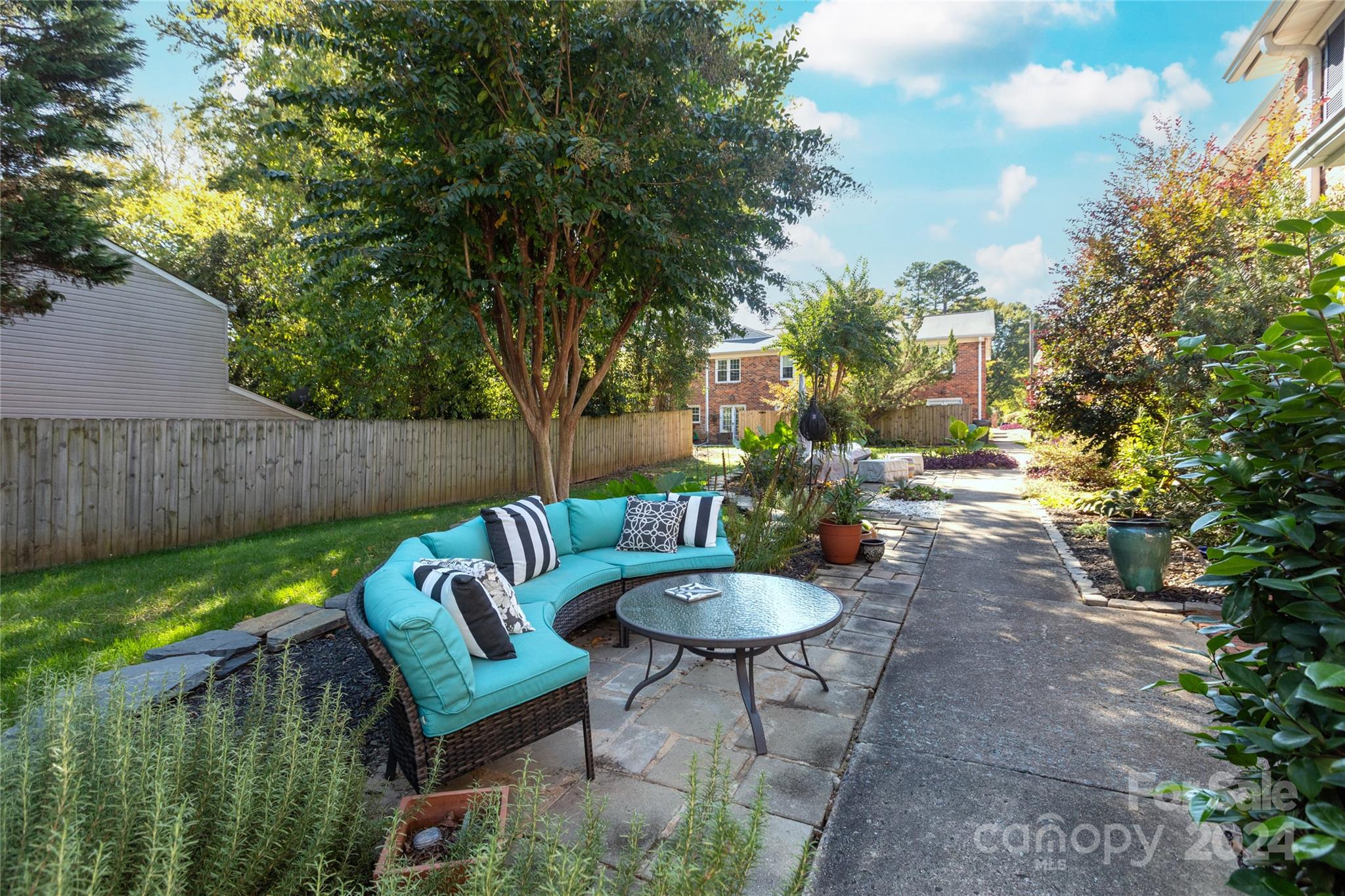 856 McAlway Road, Unit B Charlotte, NC 28211 - Photo 24 of 25 a view of a backyard with plants and a patio