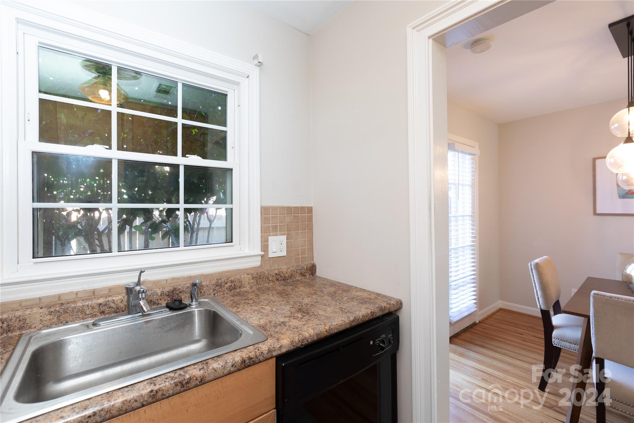 856 McAlway Road, Unit B Charlotte, NC 28211 - Photo 9 of 25 a kitchen that has a sink and a window in it