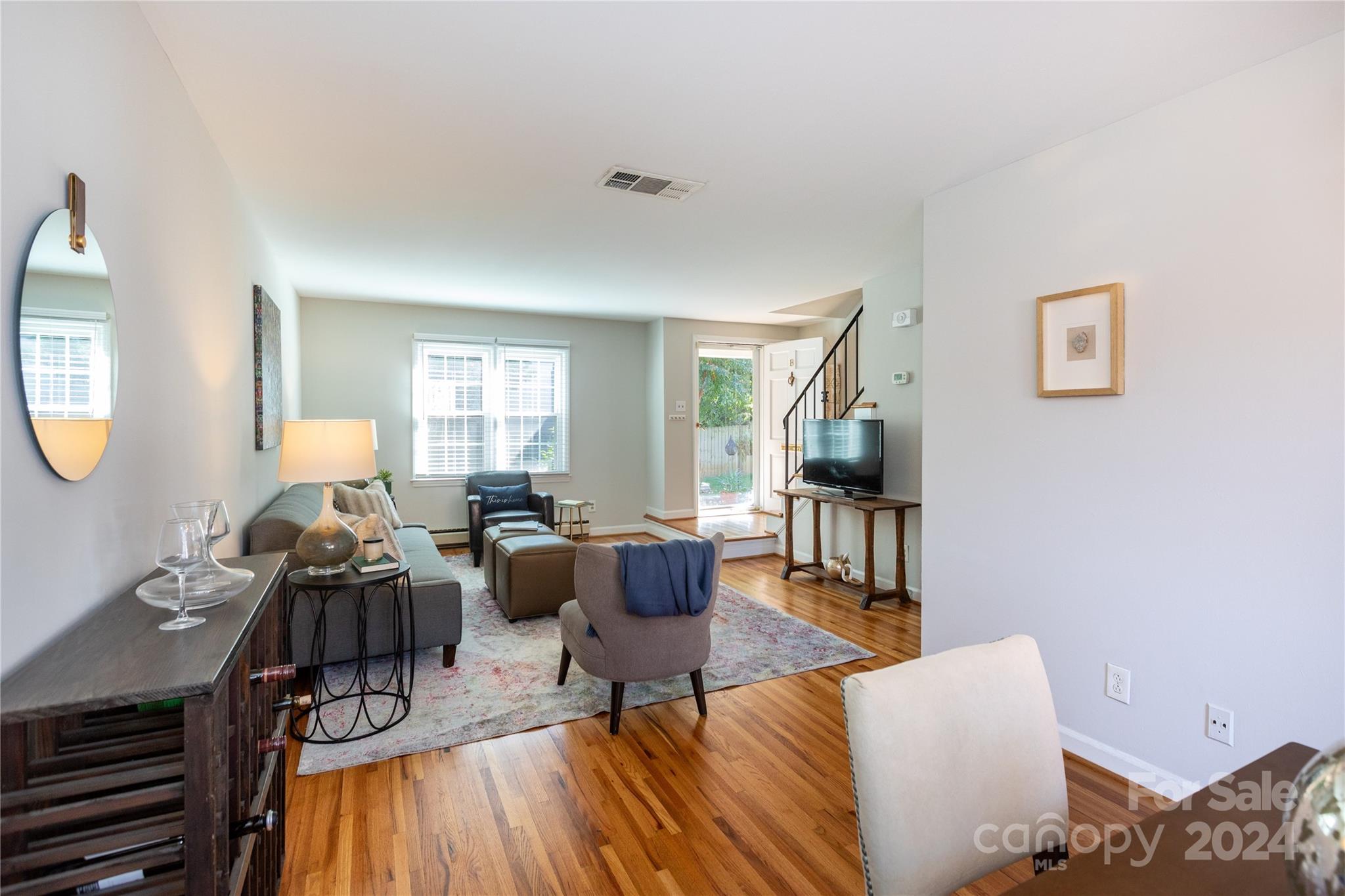 856 McAlway Road, Unit B Charlotte, NC 28211 - Photo 10 of 25 a living room with furniture and a wooden floor