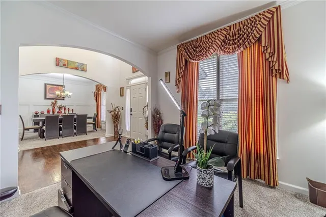 a dining room with furniture and window