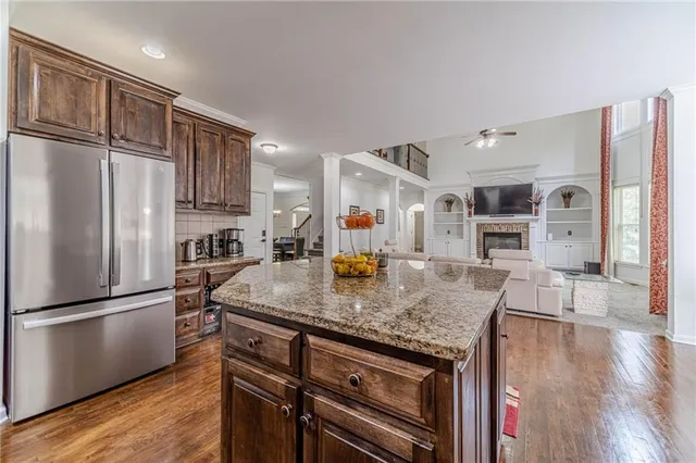 a bedroom with a bed and a flat tv screen on a dresser