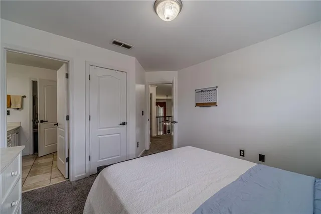 a bathroom with a sink vanity and a mirror