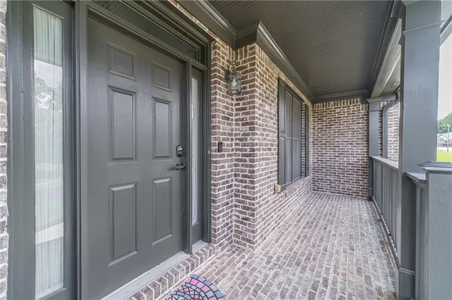a view of a dining room with furniture and window