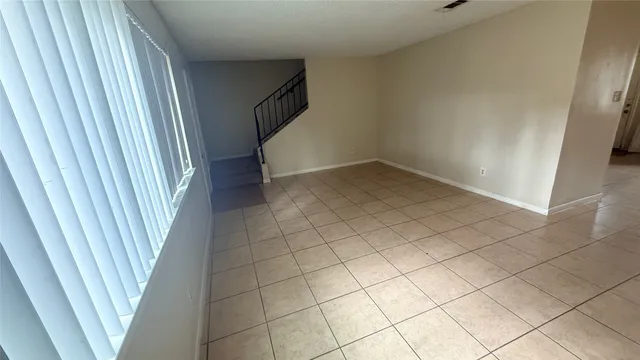 a view of a room with white walls