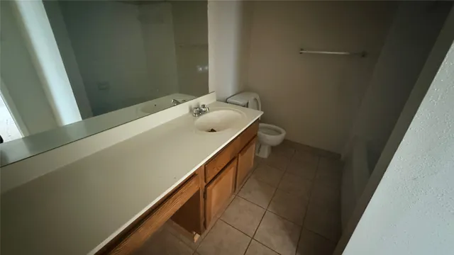 a bathroom with a sink and mirror