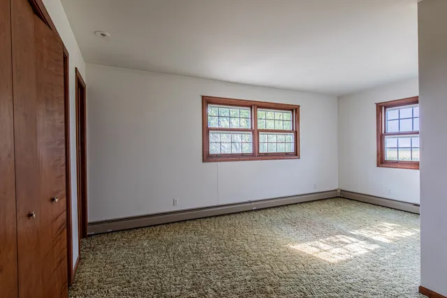 an empty room with windows