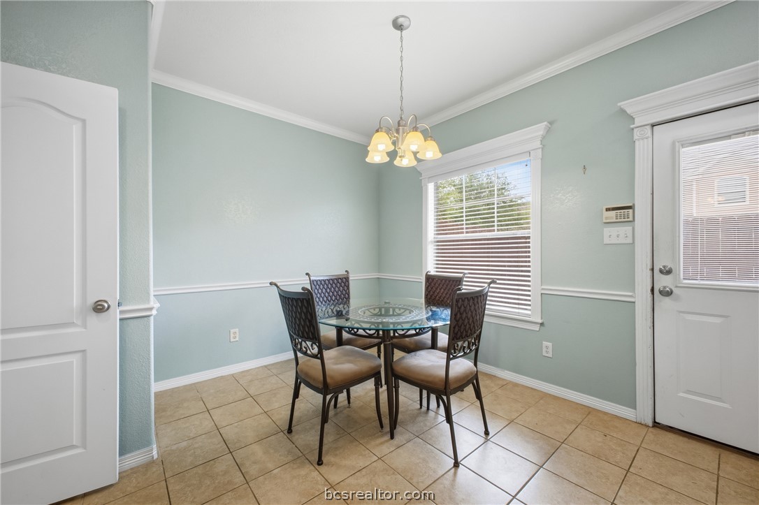 1000 Spring Loop, Unit 2105 College Station, TX 77840 - Photo 4 of 22 a dining room with furniture and window