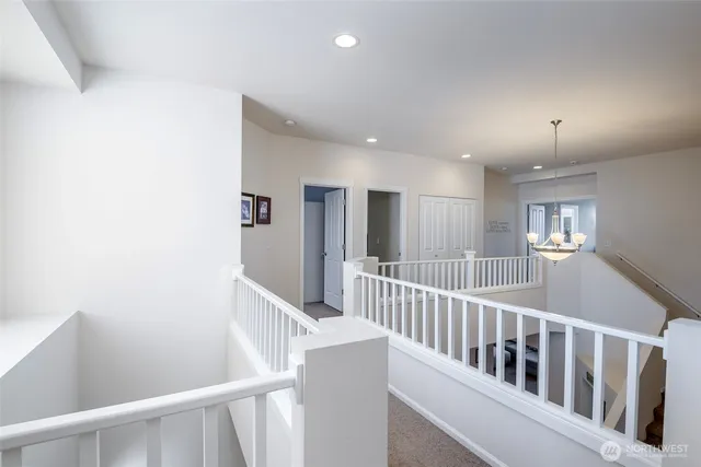 a view of a hallway with windows