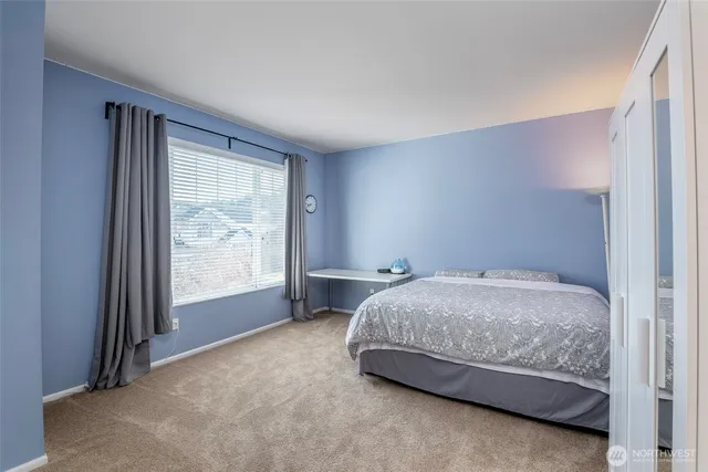 a room with a bed and a window