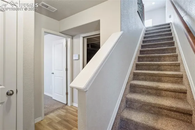 a view of staircase with white walls and white walls
