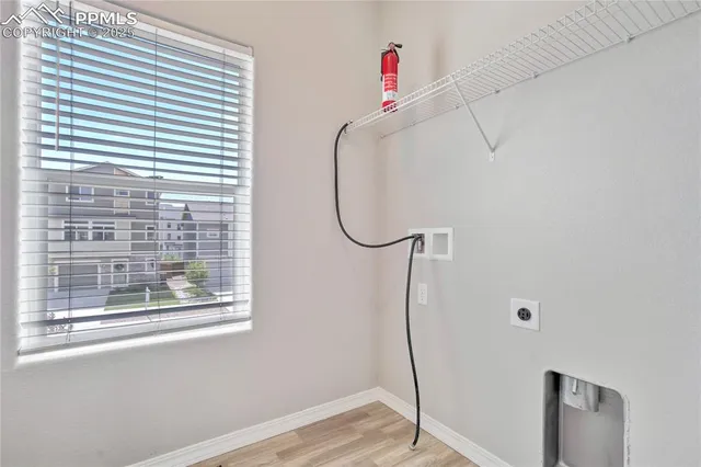 a bathroom with a window and a shower