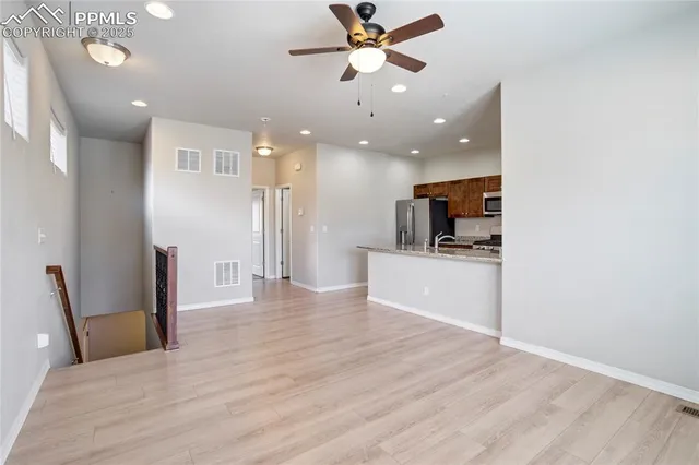 a view of a kitchen and a window