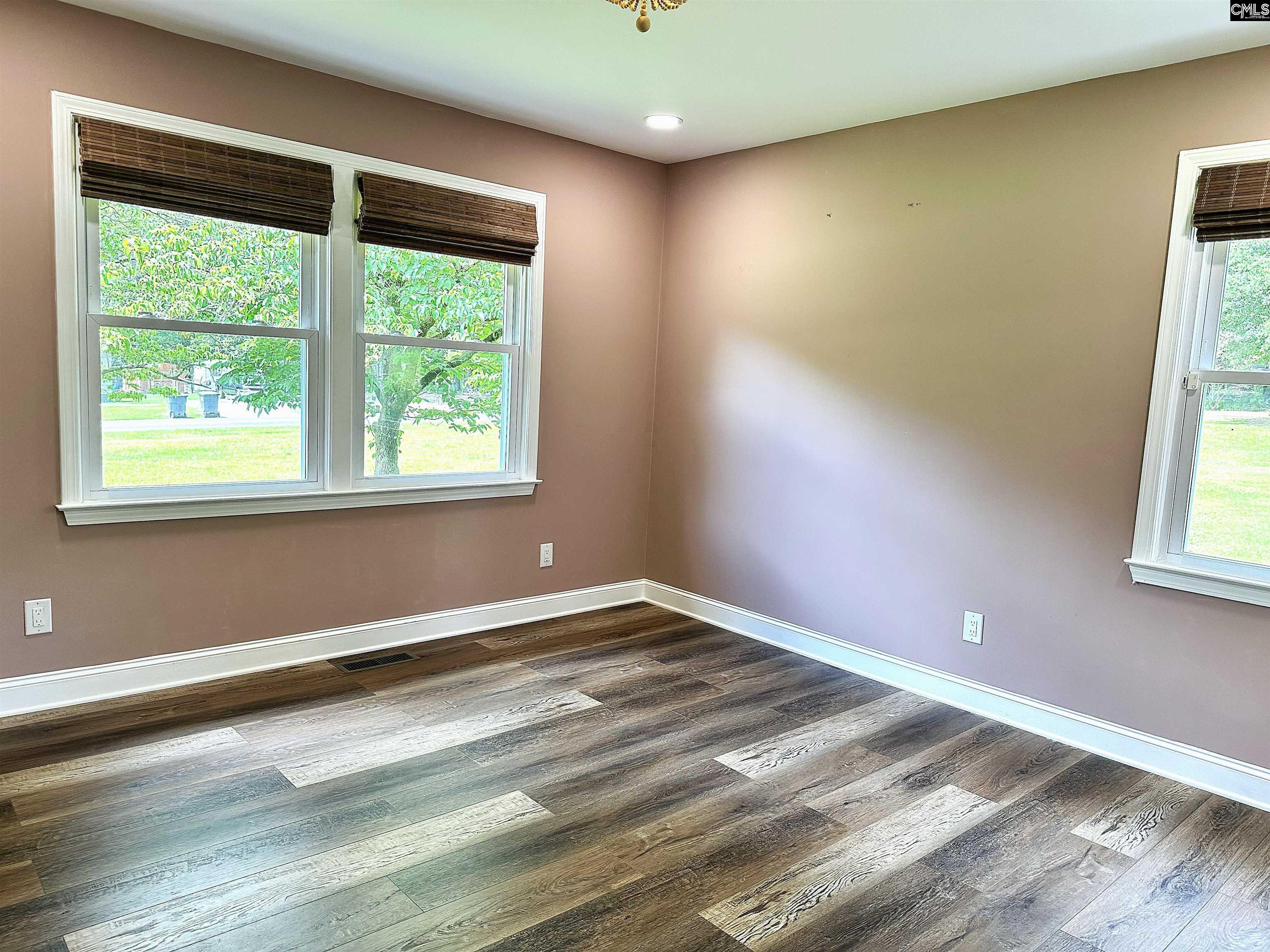 535 Sandbar Road Chapin, SC 29036 - Photo 20 of 23 an empty room with wooden floor and windows
